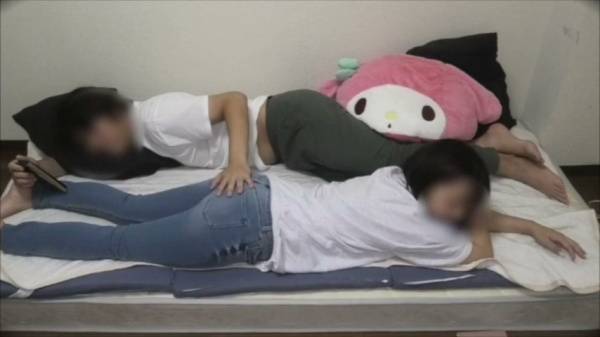 Two Japanese girls spend their day off in bed with a strapon, squirting and pissing - Japan on adultfans.net