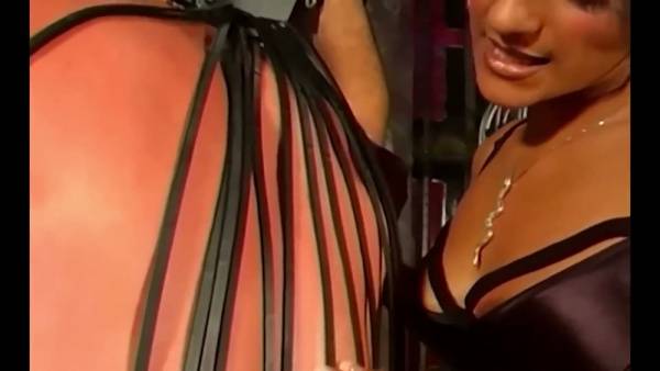 Mistress Delilah commands her leather-clad submissives in a dungeon session on adultfans.net