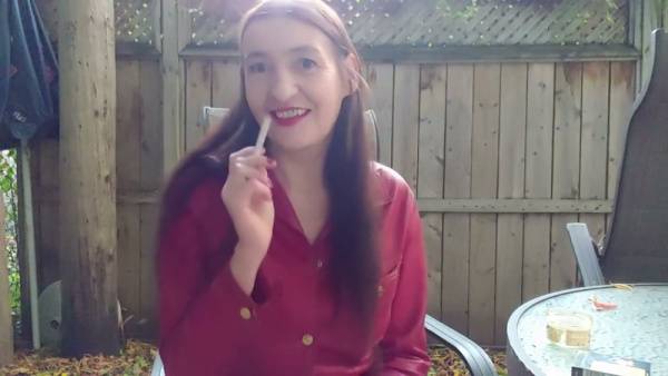 Mature brunette captivates with smoldering boot in candlelit garden shed on adultfans.net