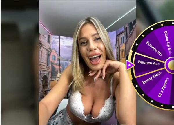 Blonde woman in white lace bra slowly reveals her large natural breasts in a selfie session on adultfans.net