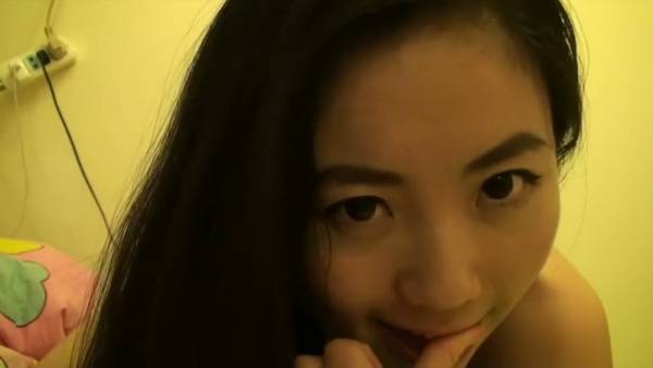Taiwanese girl Lin Xiaoxia explores her body in private on a dimly lit bed - Taiwan on adultfans.net