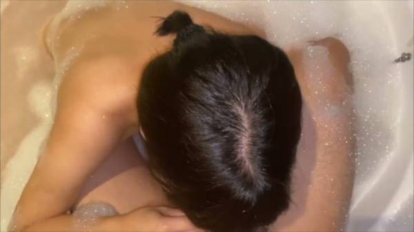 Dark-haired Asian girlfriend gives oral in a frothy love hotel bath - Japan on adultfans.net
