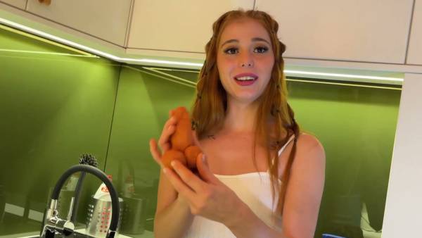 Redhead lya teases with full exposure in a sleek kitchen under voyeur eyes on adultfans.net