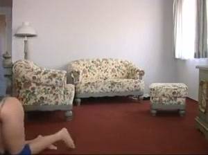 Pony girl lifted onto the floral sofa during a BDSM session on adultfans.net