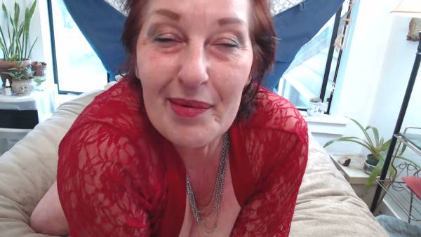Mature redhead woman embraces her natural curves in intimate solo scenes on adultfans.net
