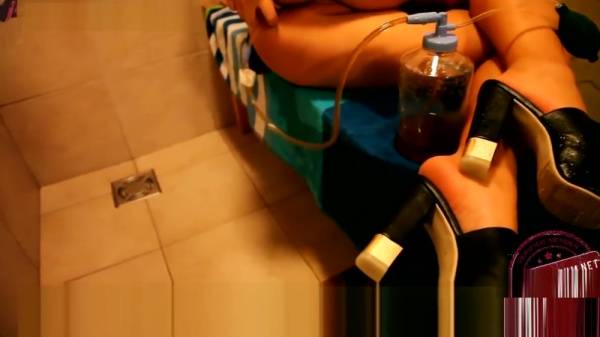 Amateur wife explores her enema fetish with milk and toys in the bathroom on adultfans.net