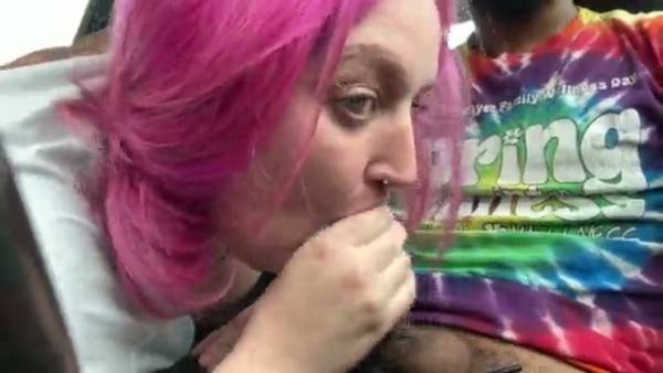Pink-haired woman gives intense car blowjob to black man on break on adultfans.net