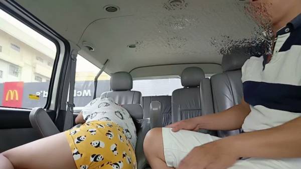 Skinny couple gets intimate in a parked car near a fast food outlet on adultfans.net