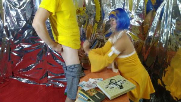 Blue-haired girl in yellow cosplay dress pulls down his pants then takes creampie on books on adultfans.net