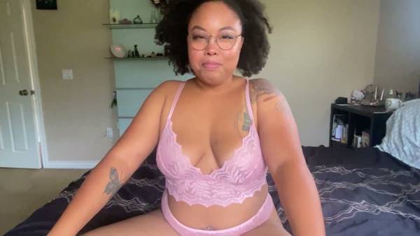 Curvy ebony woman in glasses gives firm jerk off commands from bed on adultfans.net