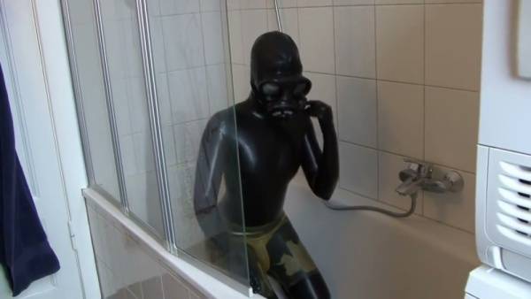 Latex-clad woman explores breathplay and self-restraint in a stark white bathroom - Germany on adultfans.net