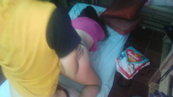 Red-haired MILF in pink top and black thong takes her man from behind on adultfans.net
