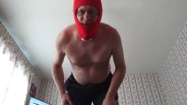 Masked muscular man in red balaclava jerks off on camera on adultfans.net