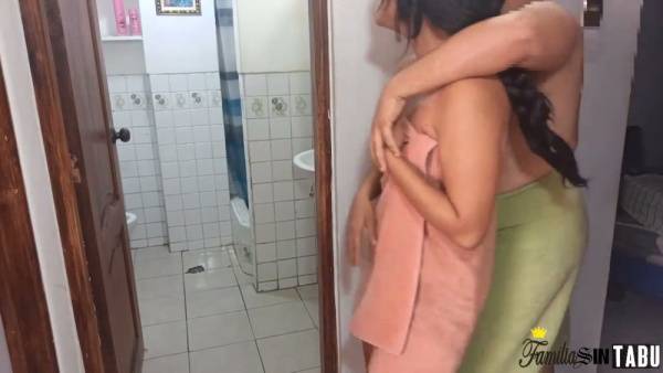 Wet skin glistens in the bathroom as a couple shares an intimate moment after showering on adultfans.net