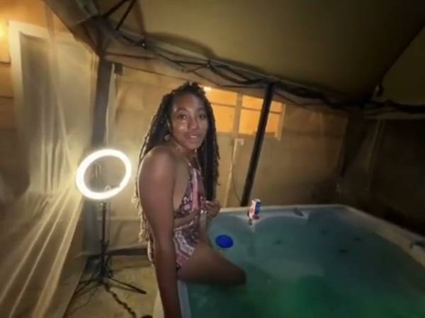 Dark-haired Jamaican beauty bares her curves alone in a glowing hot tub - Jamaica on adultfans.net