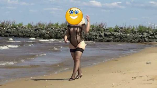 Mature Russian woman pleasures herself on a secluded sandy beach - Russia on adultfans.net