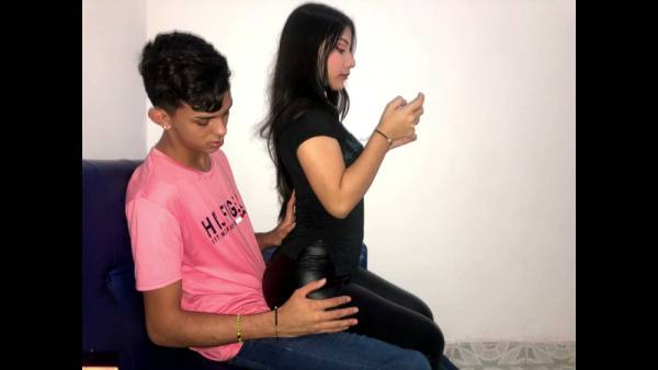 Brunette caught in passionate climax during intimate encounter on leather couch on adultfans.net