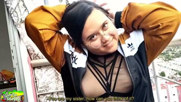 Curvy woman in glasses gives deep throat on a balcony with city views on adultfans.net