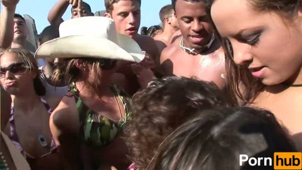 College beach party heats up with bikini teasing and passionate kissing among sun-soaked students on adultfans.net