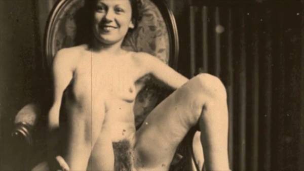 A hairy vintage couple explores passion in a sepia-toned boudoir on adultfans.net