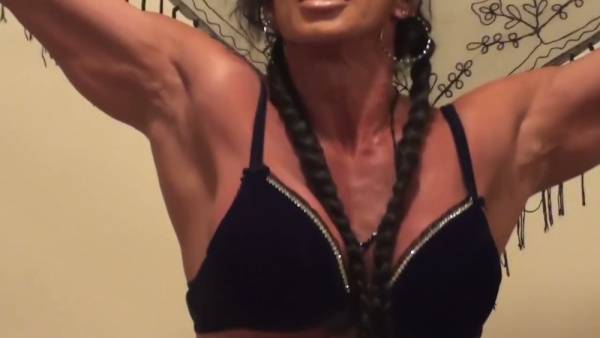 Muscular ebony brunette shows off her big ass in solo martial arts fantasy on adultfans.net