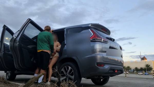 Young Filipina spills creampie during outdoor car sex in roadside parking on adultfans.net