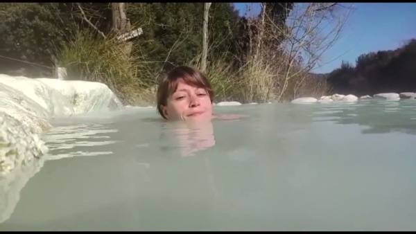 Young brunette basks nude in the natural thermal pools of Petriolo, Tuscany - Italy on adultfans.net