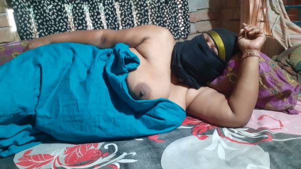 Dark-skinned woman in a mask takes deep on the floral bed on adultfans.net