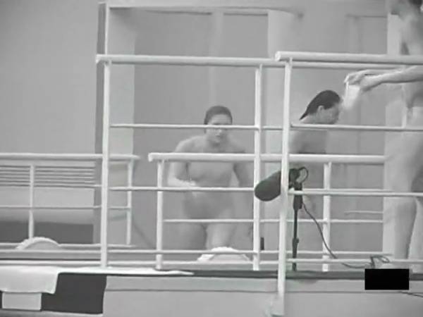 Monochrome study of nude figures in motion within an indoor gym and dance space on adultfans.net