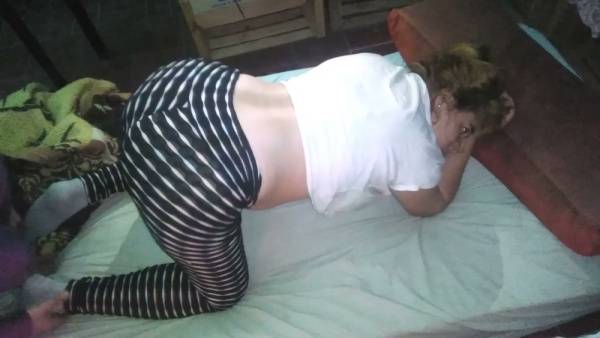 Latina MILF bends over the bed as her partner pulls down her thong on adultfans.net