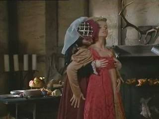 Two medieval noblewomen share intimate moments before a rustic barn encounter with a knight on adultfans.net