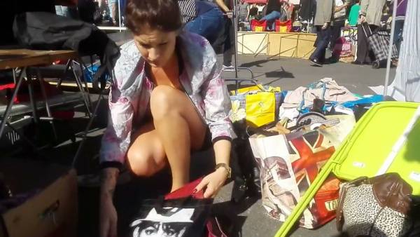 Hidden camera captures women bending and exposing cleavage at outdoor markets on adultfans.net