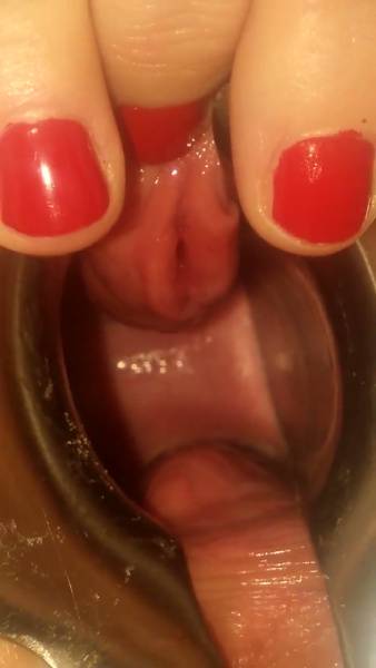 Blonde explores her pussy with a speculum and silicone toys in intimate close-up on adultfans.net