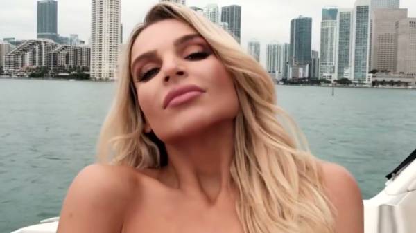 Blonde with big tits teases alone on a rocking boat at sunset on adultfans.net