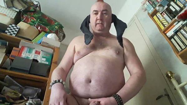 Overweight man with a foot fetish gives himself a handjob in his messy room on adultfans.net