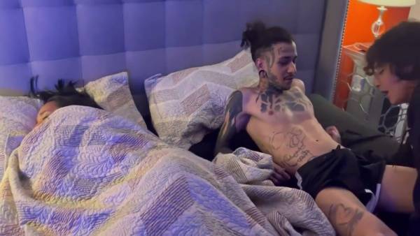 Tattooed brunette rides her man from behind in dim purple light on adultfans.net