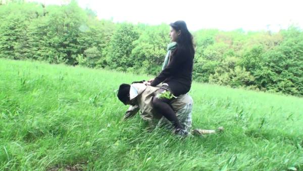 A dominant woman rides her pony boy bareback in a gritty outdoor scene on adultfans.net
