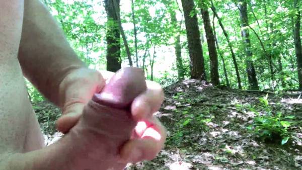 Man hikes naked through the forest while edging with his hand on his cock on adultfans.net