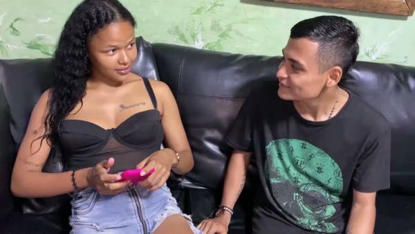 Latina woman enjoys passionate cunnilingus from a dark-skinned man on a leather couch on adultfans.net