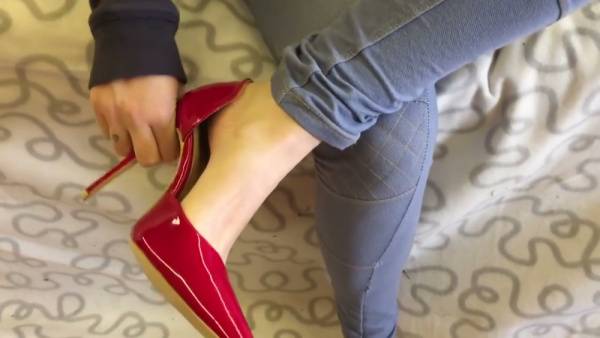 Red stiletto domination with footjobs and shoe-fueled control on adultfans.net