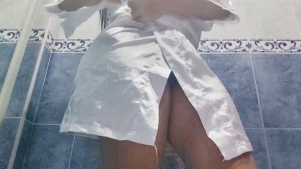 Plump brunette caught on hidden camera during an intimate bathroom moment in a hotel on adultfans.net