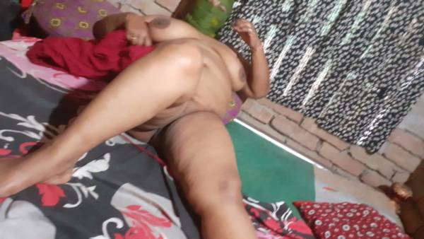 Indian woman lies nude on a floral bedspread with legs open in a bedroom - India on adultfans.net