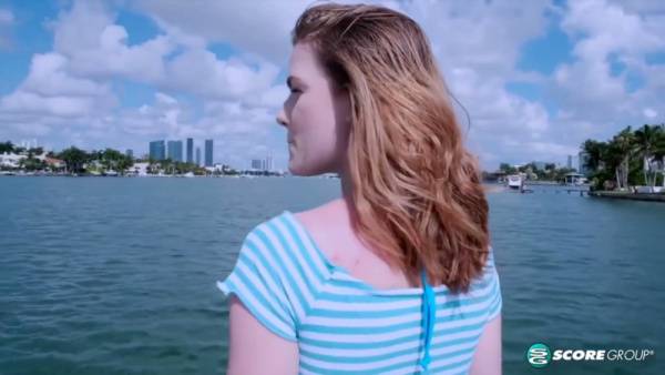 Redhead Emma Johnson fingers herself openly on a sunlit yacht on adultfans.net