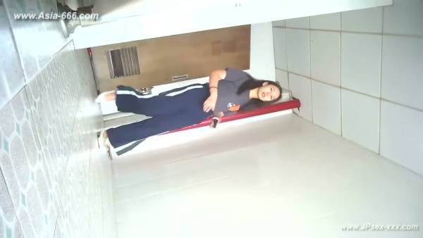 Young Chinese woman unknowingly filmed urinating in a white-tiled bathroom - China on adultfans.net