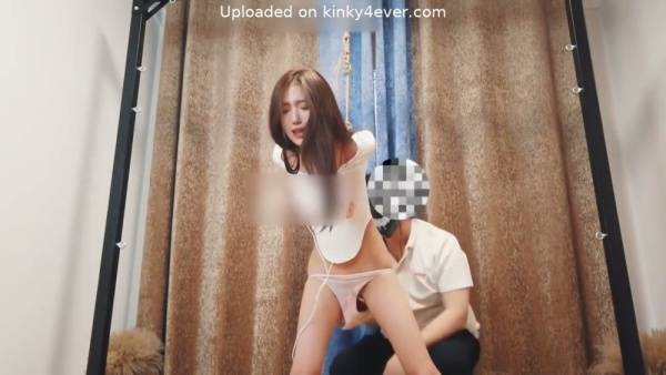 Young Asian woman in white lace lingerie bound with rope on tatami floor on adultfans.net
